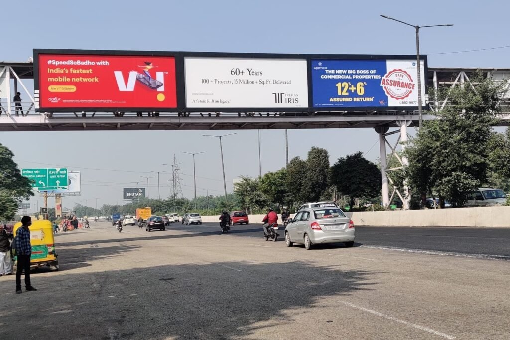 Outdoor advertising service with multiple billboard ads on highway foot over bridge
