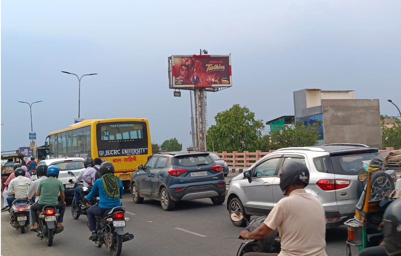 Highway Hoarding Advertising Companies in Rajasthan showcasing a large outdoor billboard promoting a brand along a busy national highway. Highway Hoarding Advertising Companies in Rajasthan showcasing a large outdoor billboard promoting a brand along a busy national highway.
