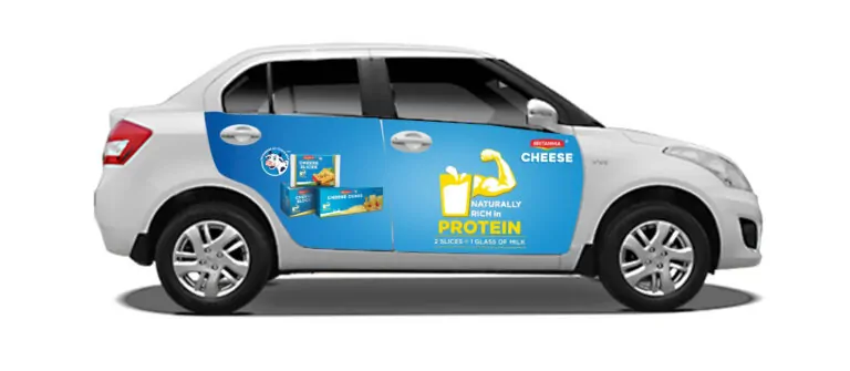 "Amul Cheese cab branding on Swift Dzire – taxi wrap by ACME Advertising promoting protein-rich dairy in Delhi NCR."