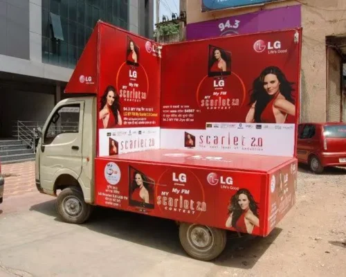 Truck advertising vehicle promoting LG Scarlet 2.0 film contest with branded visuals and celebrity-led campaign.