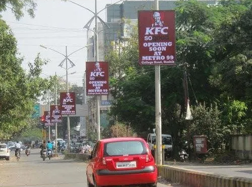 High traffic pole kiosk media by Acme Advertising for urban brand promotion